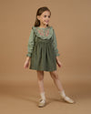 Early Sunday, Lauren Blouse in Halcyon Green color, made from Cotton Double Gauze fabric, featuring relaxed fit with a floral embroidered yoke, shown in front view of model wearing it