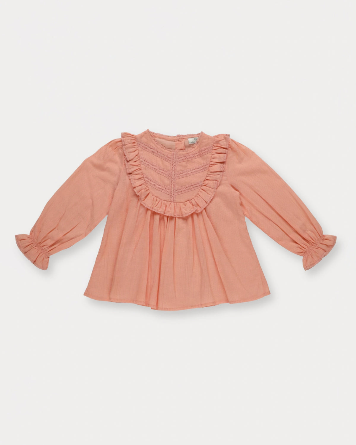 Early Sunday, Lauren Blouse in Blush, made from Cotton Jeera Dobby Voile fabric, featuring layered lace-trimmed ruffles and delicate pintuck detailing on the yoke, shown in a front flat-lay view