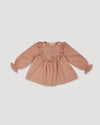 Early Sunday, Lauren Blouse in Earthy Pink, made from Cotton Swiss Dobby fabric, featuring relaxed fit with a floral embroidered yoke, shown in a front flat-lay view