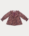 Early Sunday, Lauren Blouse in Plum, made from Printed Cotton Satin fabric, featuring layered lace-trimmed ruffles and delicate pintuck detailing on the yoke, shown in a front flat-lay view