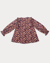 Early Sunday, Lauren Blouse in Plum, made from Printed Cotton Satin fabric, featuring layered lace-trimmed ruffles and delicate pintuck detailing on the yoke, shown in a back flat-lay view