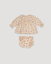 Early Sunday, Libby Baby Dress & Bloomer Set in Ditsy Bouquet Cream print color, made from Printed Viscose Rayon Twill fabric, featuring long sleeves with frilly neck & floral print, shown in a back flat-lay view