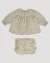 Early Sunday, Libby Baby Dress & Bloomer Set in Ditsy Bouquet Jade print, made from Printed Viscose Rayon Twill fabric, featuring long sleeves with frilly neck & floral print, shown in a back flat-lay view