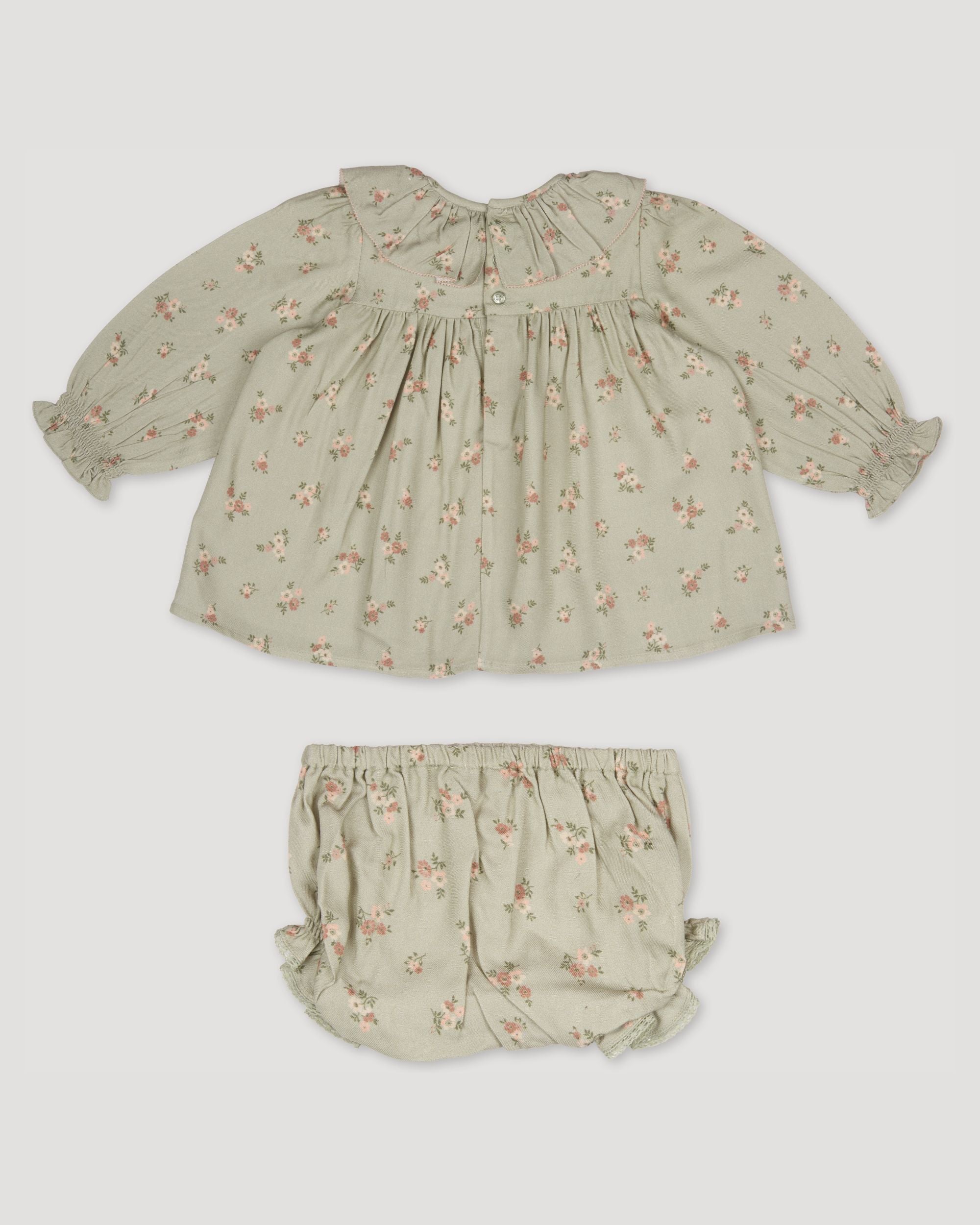 Early Sunday, Libby Baby Dress & Bloomer Set in Ditsy Bouquet Jade print, made from Printed Viscose Rayon Twill fabric, featuring long sleeves with frilly neck & floral print, shown in a back flat-lay view