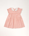 Early Sunday, Lila Dress in Peony color, made from 100% cotton gingham checks fabric, featuring Scalloped neckline with contrast stitching, flutter sleeves, gentle gathers, and embroidered hem detail, shown in a front flat-lay view