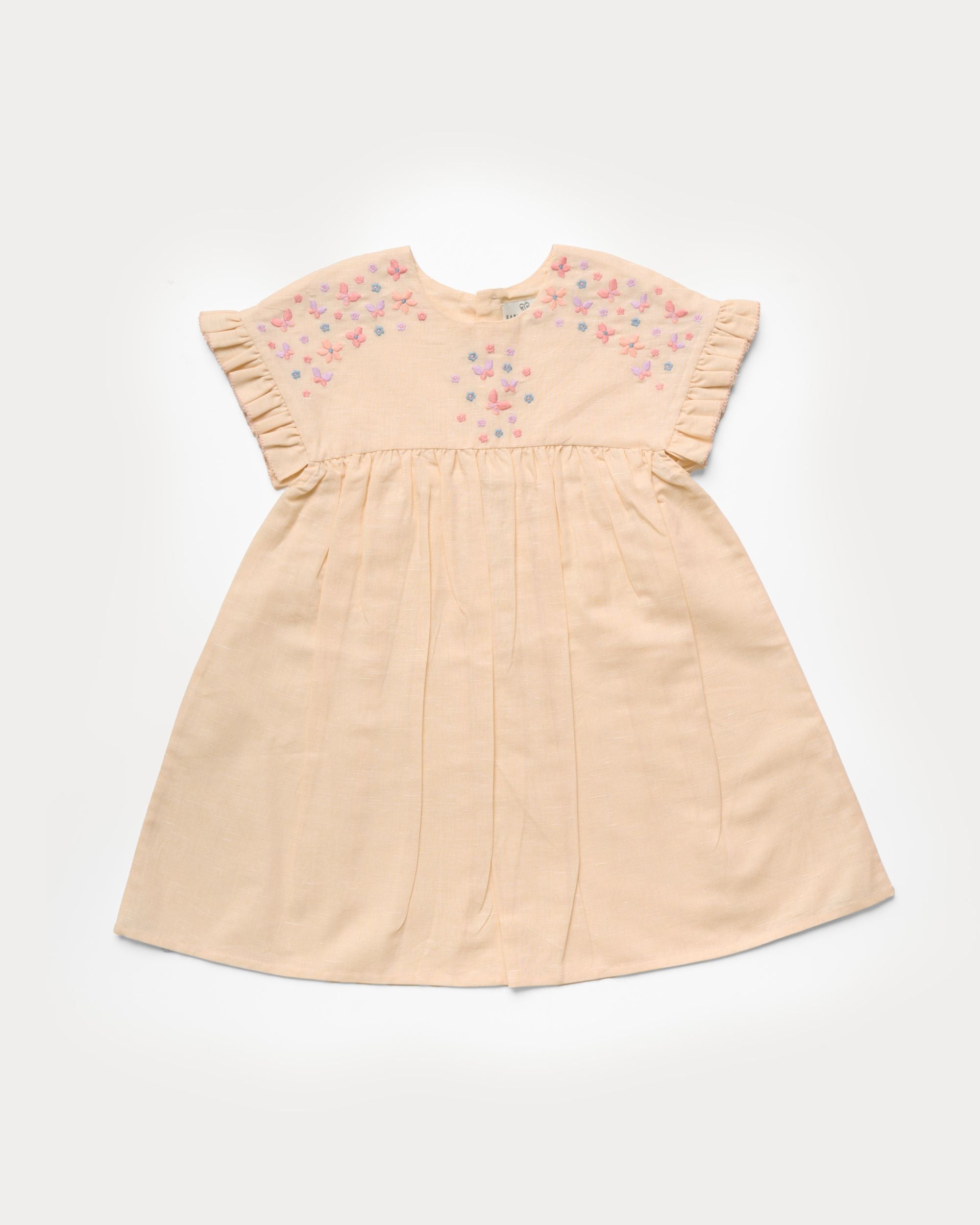 Early Sunday, Lila Dress in Sand color, made from 70% cotton 30% linen solid fabric, featuring Scalloped neckline with contrast stitching, flutter sleeves, gentle gathers, and embroidered hem detail, shown in a front flat-lay view