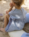 Early Sunday, Lila Dress in Ocean Blue color, made from Canvas 70% Cotton 30% Linen fabric, featuring a flattering mini dress with a relaxed fit, designed for comfort and effortless style, shown in back view of model wearing it