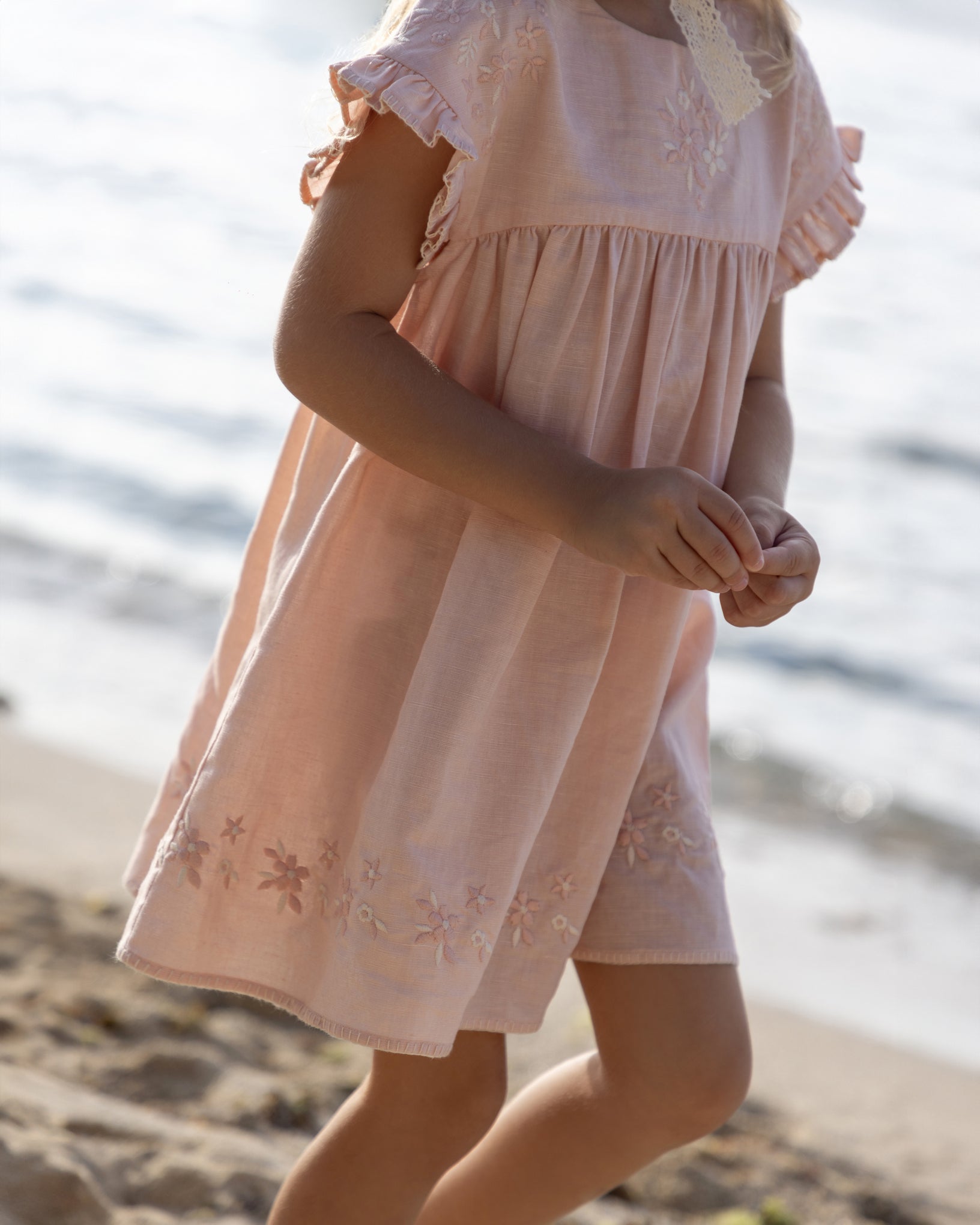 Early Sunday, Lila Dress in Pink Sand color, made from Canvas 70% Cotton 30% Linen fabric, featuring a flattering mini dress with a relaxed fit, designed for comfort and effortless style, shown in a close-up shot of the print