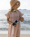 Early Sunday, Lila Dress in Pink Sand color, made from Canvas 70% Cotton 30% Linen fabric, featuring a flattering mini dress with a relaxed fit, designed for comfort and effortless style, shown in a front view of model wearing it