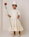 Early Sunday, Lilly Dress in Hazelnut Cream, made from All-Over Embroidered Cotton Cambric fabric, featuring Delicate floral embroidery placed softly across the dress for a timeless, heirloom-inspired finish, shown in a front view of a model wearing it in a studio setting