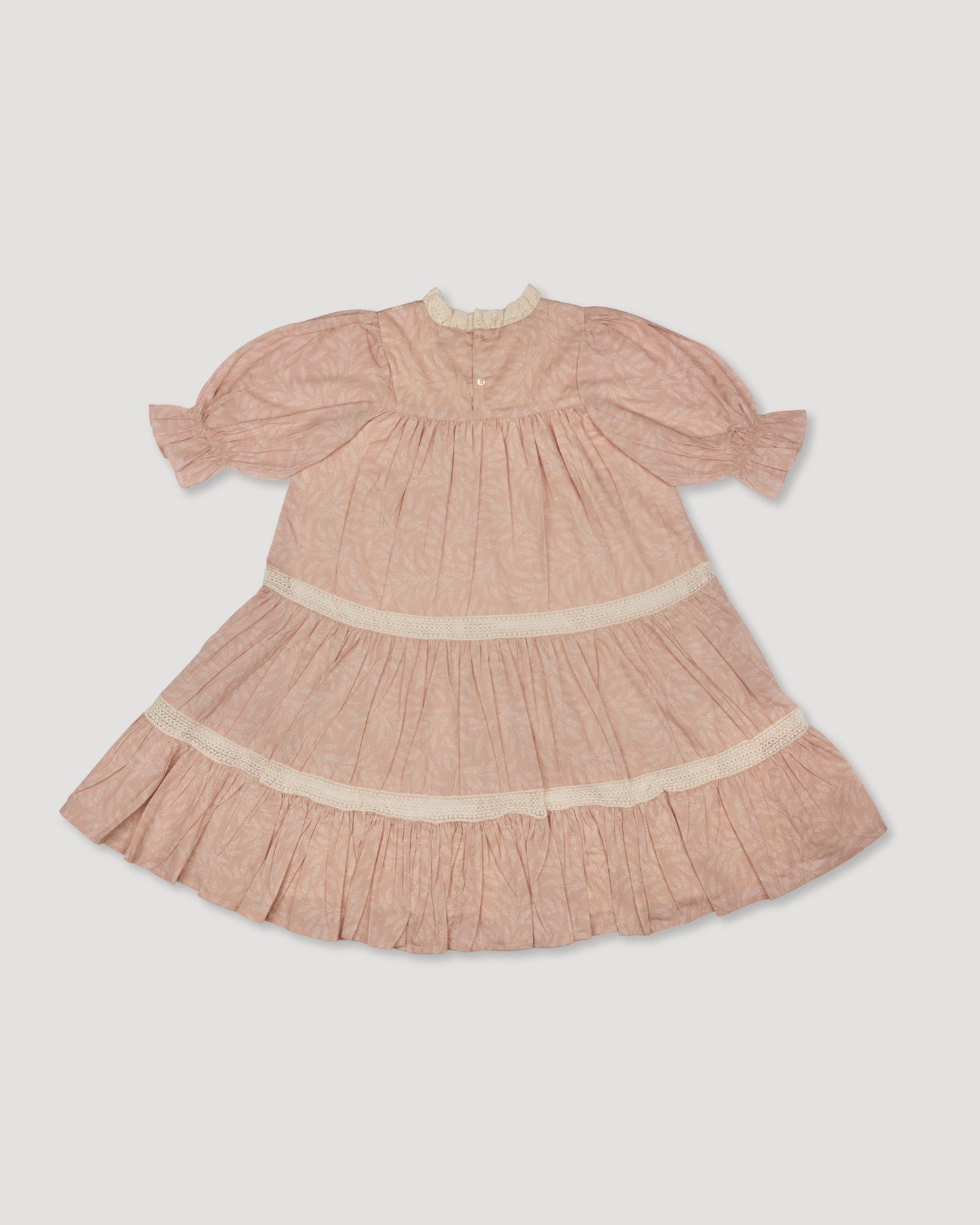Early Sunday, Lilly Dress in Feather print, made from Printed Cotton Cambric fabric, featuring Delicate floral embroidery placed softly across the dress for a timeless, heirloom-inspired finish, shown in a back flat-lay view