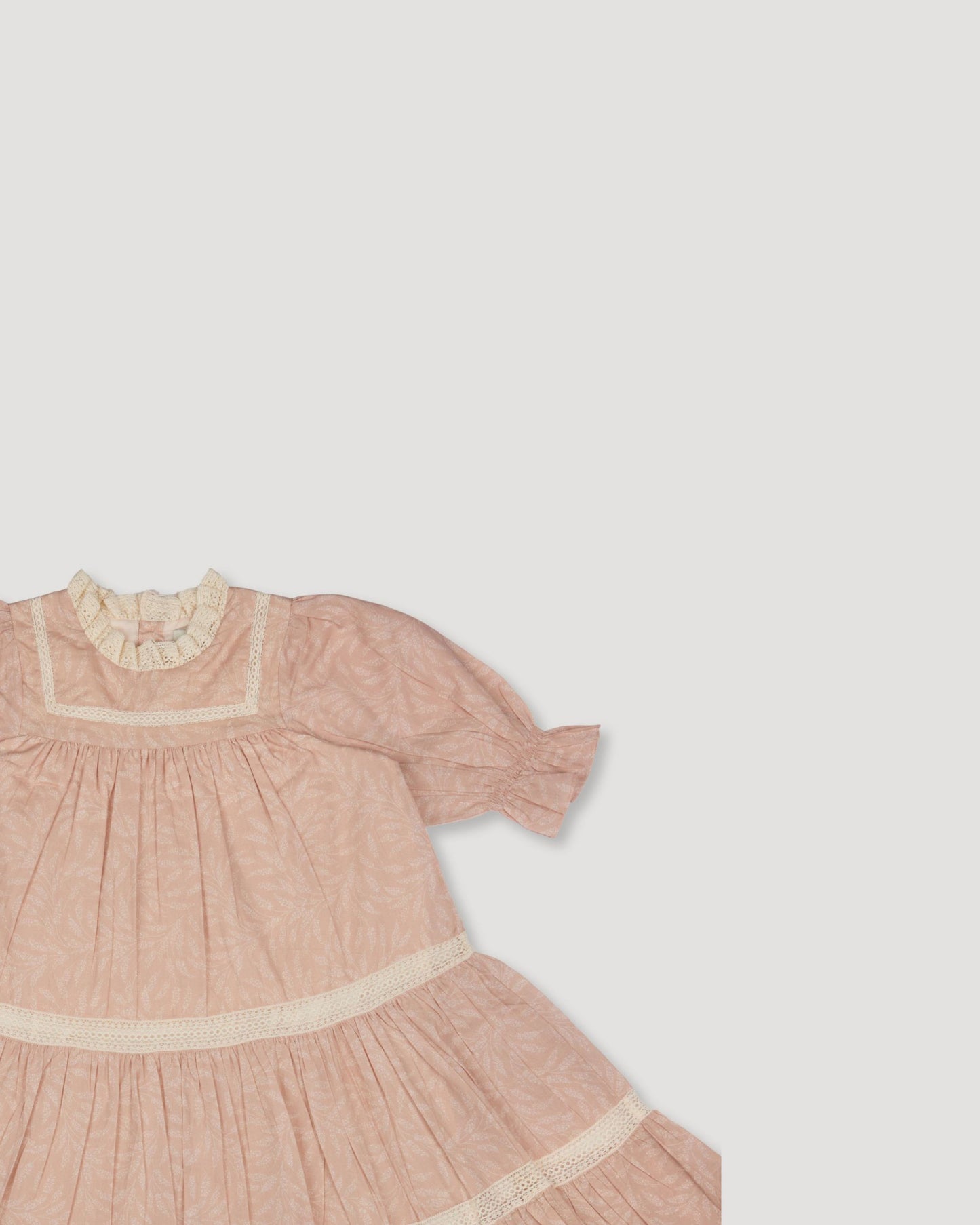 Early Sunday, Lilly Dress in Feather print, made from Printed Cotton Cambric fabric, featuring Delicate floral embroidery placed softly across the dress for a timeless, heirloom-inspired finish, shown in a closeup flat-lay view