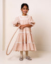 Early Sunday, Lilly Dress in Feather print, made from Printed Cotton Cambric fabric, featuring Delicate floral embroidery placed softly across the dress for a timeless, heirloom-inspired finish, shown in a front view of a model wearing it in a studio setting