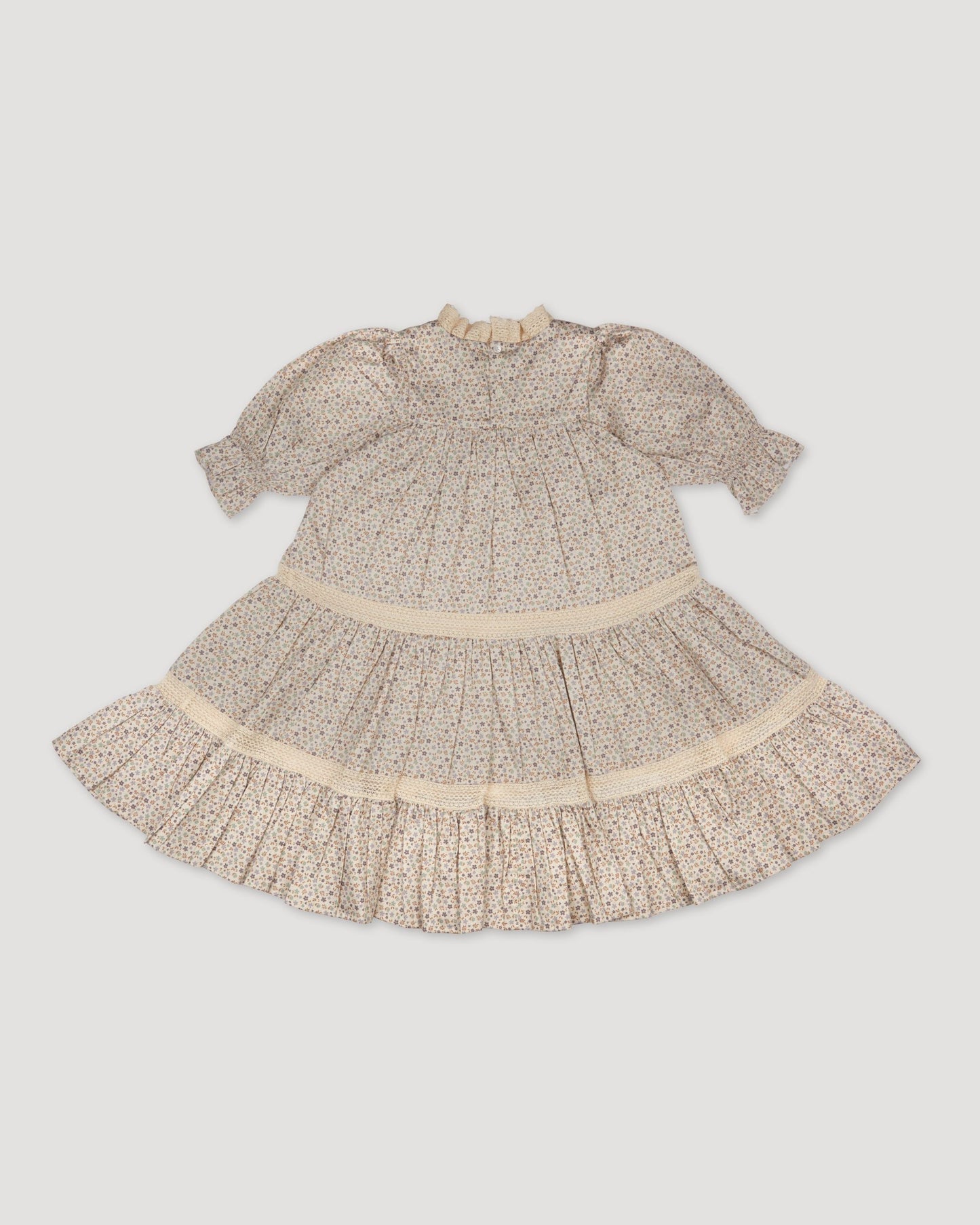 Early Sunday, Lilly Dress in Miny Flowers print, made from Printed Cotton Satin fabric, featuring Delicate floral embroidery placed softly across the dress for a timeless, heirloom-inspired finish, shown in a back flat-lay view