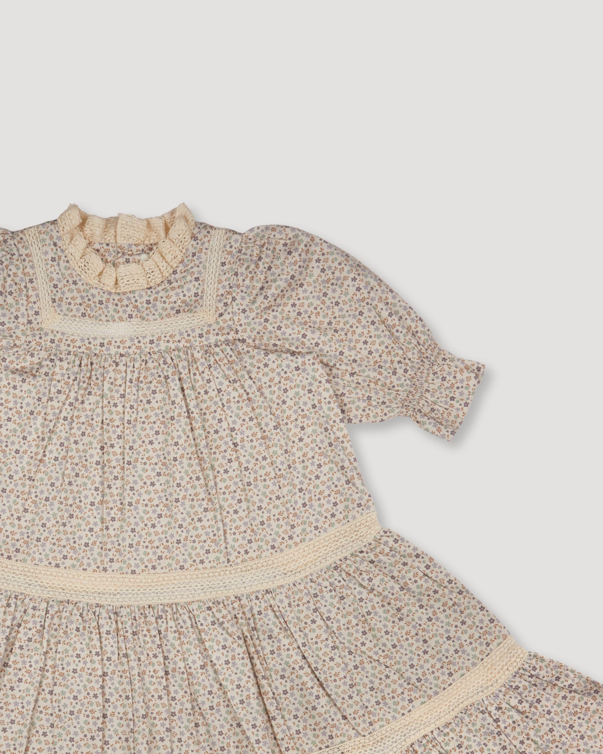 Early Sunday, Lilly Dress in Miny Flowers print, made from Printed Cotton Satin fabric, featuring Delicate floral embroidery placed softly across the dress for a timeless, heirloom-inspired finish, shown in a closeup flat-lay view