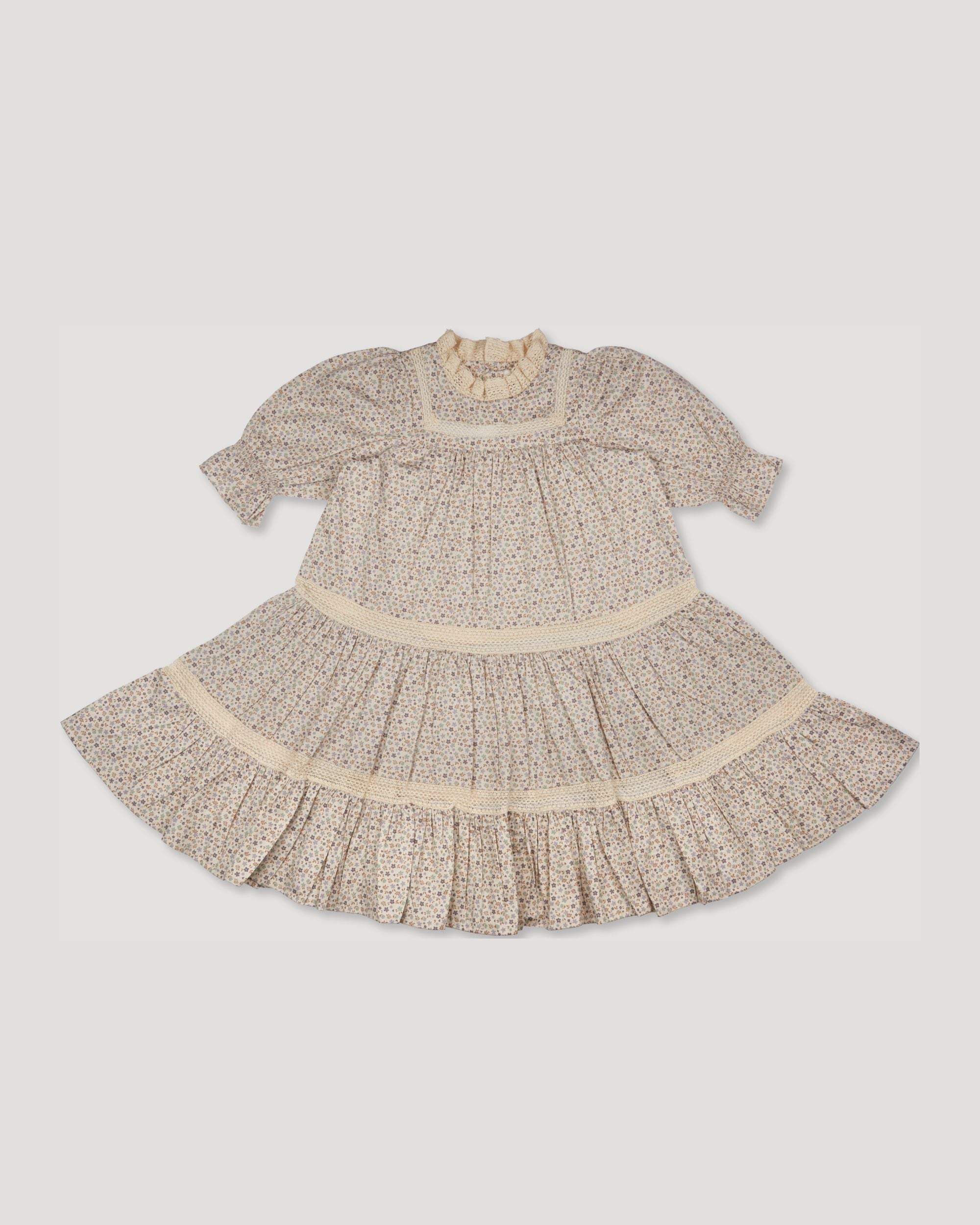 Early Sunday, Lilly Dress in Miny Flowers print, made from Printed Cotton Satin fabric, featuring Delicate floral embroidery placed softly across the dress for a timeless, heirloom-inspired finish, shown in a front flat-lay view