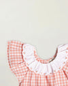 Early Sunday, Lola Blouse in Peony color, made from 100% cotton gingham checks fabric, featuring Ruffled neckline, flutter sleeves with contrast detailing, and gentle gathers for a sweet silhouette, shown in a closeup flat-lay view