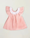 Early Sunday, Lola Blouse in Peony color, made from 100% cotton gingham checks fabric, featuring Ruffled neckline, flutter sleeves with contrast detailing, and gentle gathers for a sweet silhouette, shown in a front flat-lay view