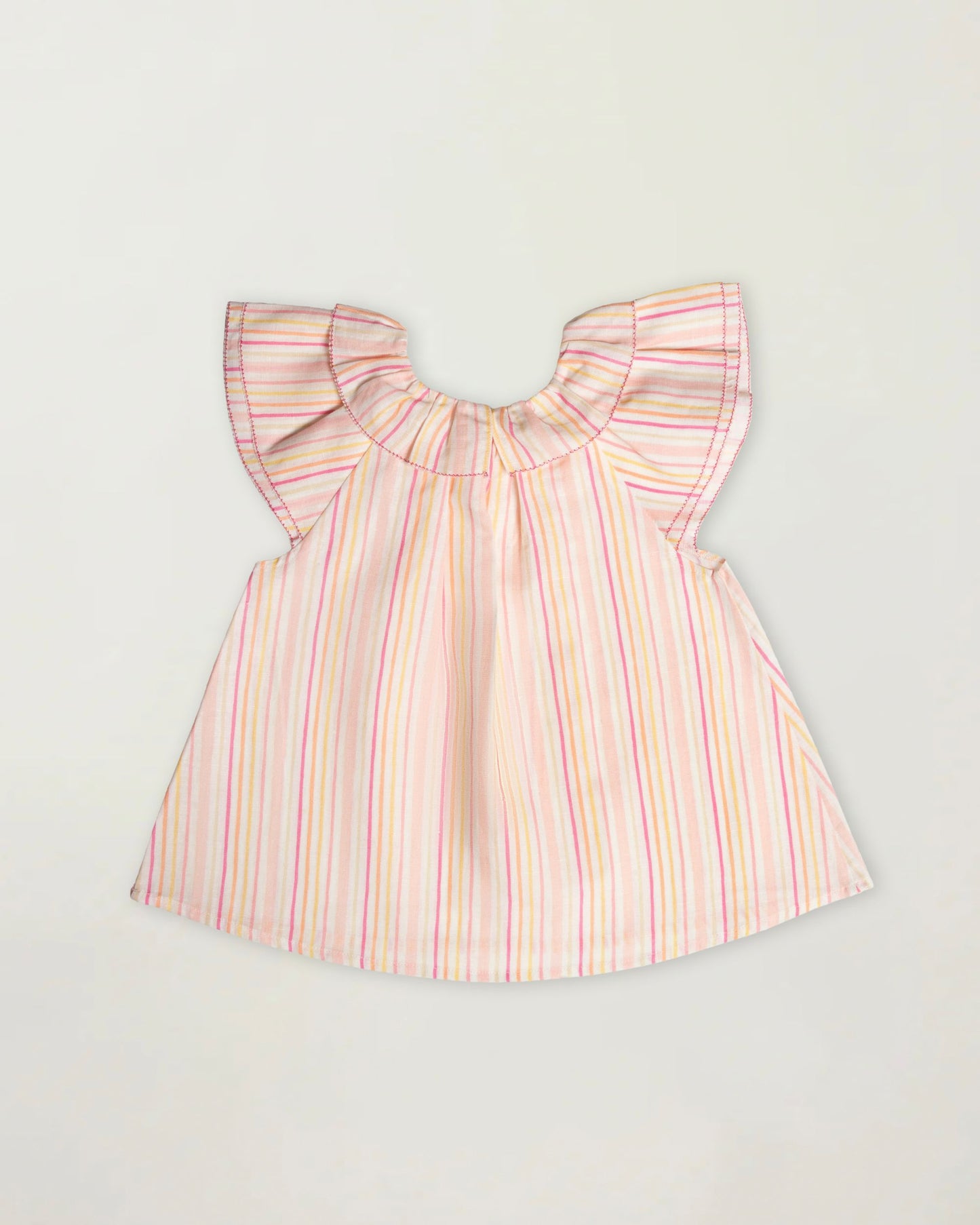 Early Sunday, Lola Blouse in Pink Stripes color, made from printed 70% cotton 30% linen fabric, featuring Ruffled neckline, flutter sleeves with contrast detailing, and gentle gathers for a sweet silhouette, shown in a back flat-lay view