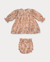 Early Sunday, Lottie Baby Dress & Bloomer Set in Bloom, made from Printed Viscose Twill fabric, featuring a frilly neckline & squared frills around the chest, shown in a back flat-lay view