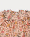 Early Sunday, Lottie Baby Dress & Bloomer Set in Bloom, made from Printed Viscose Twill fabric, featuring a frilly neckline & squared frills around the chest, shown in a closeup flat-lay view