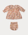Early Sunday, Lottie Baby Dress & Bloomer Set in Bloom, made from Printed Viscose Twill fabric, featuring a frilly neckline & squared frills around the chest, shown in a front flat-lay view