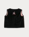 Early Sunday, Lou Vest jacket in Black, made from Cotton Velvet Velour's fabric, featuring sleeveless quilted silhouette with tie-up bow and floral embroidery, shown in a back flat-lay view