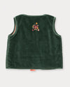 Early Sunday, Lou Vest jacket in Forest Green, made from Cotton Velvet Velour's fabric, featuring sleeveless quilted silhouette with tie-up bow and floral embroidery, shown in a back flat-lay view