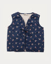 Early Sunday, Lou Vest jacket in Ditsy Bouquet Navy, made from Printed Cotton Satin fabric, featuring sleeveless quilted silhouette with tie-up bow detailing, shown in a front flat-lay view