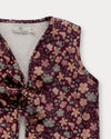 Early Sunday, Lou Vest jacket in Plum, made from Printed Cotton Satin fabric, featuring sleeveless quilted silhouette with tie-up bow detailing, shown in a closeup flat-lay view