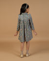 Early Sunday, Louise Dress in Autumn Garden Greyish Blue, made from Printed Cotton Satin fabric, featuring classic silhouette with a charming print, shown in a back view of model wearing it