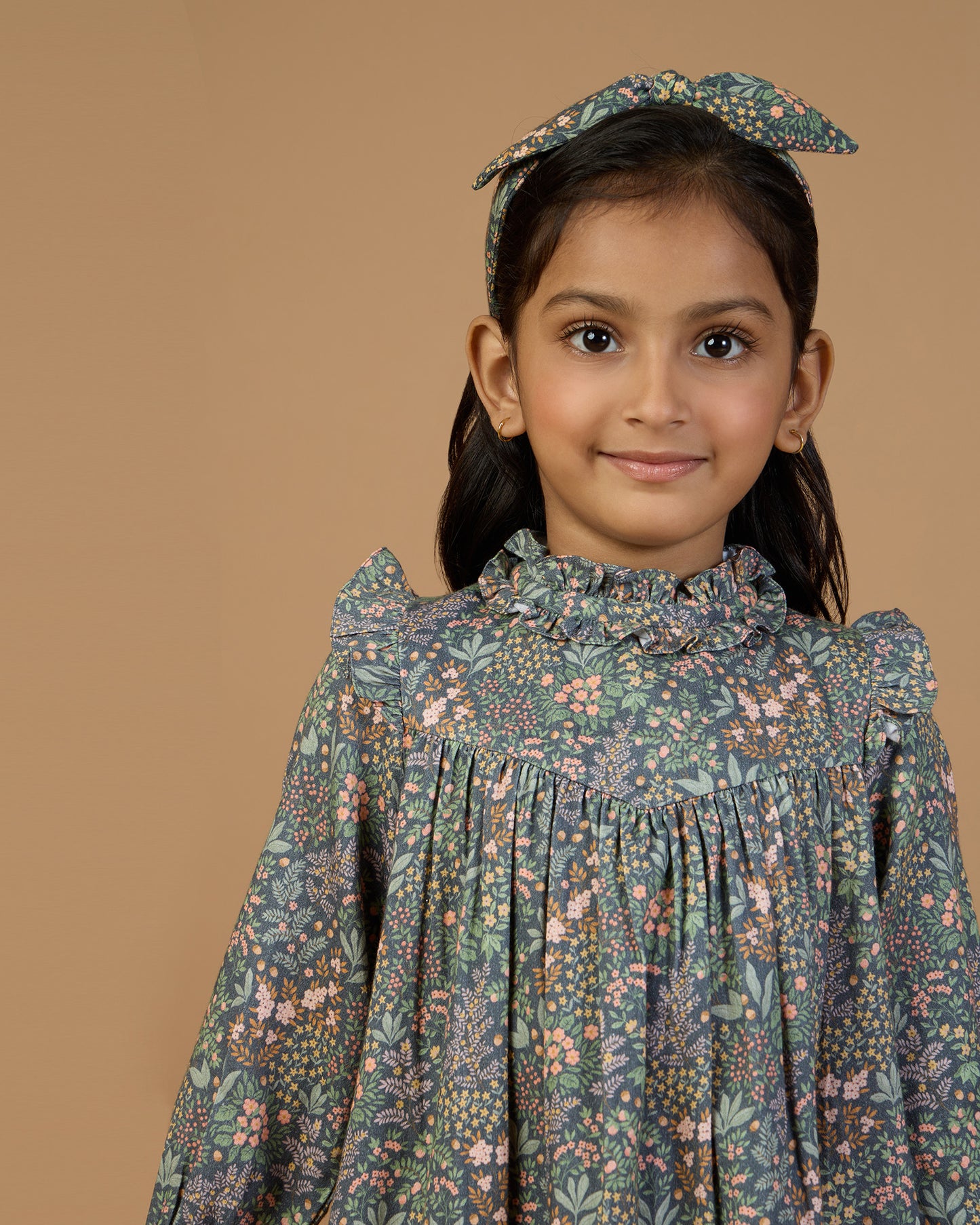 Early Sunday, Louise Dress in Autumn Garden Greyish Blue, made from Printed Cotton Satin fabric, featuring classic silhouette with a charming print, shown in a front view of model wearing it