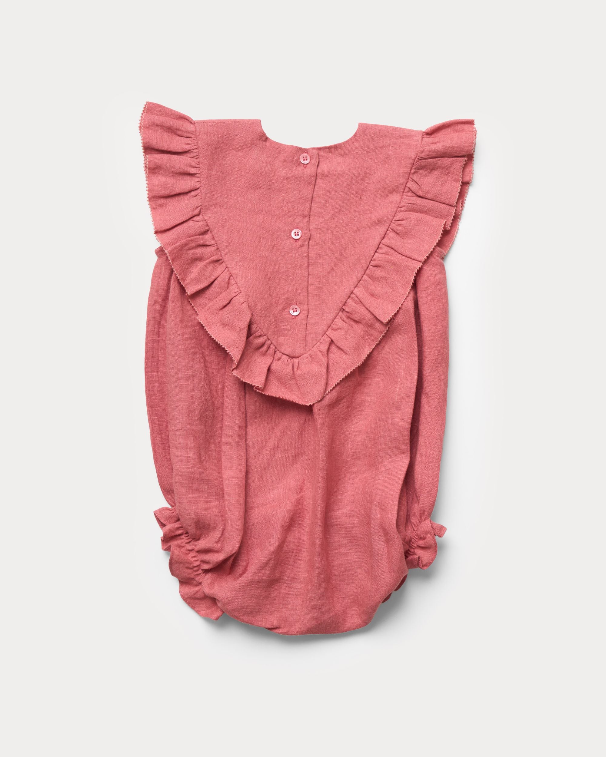 Early Sunday, Lucy Baby Bubble Romper in Peony color, made from 70% Cotton 30% Linen fabric, featuring a bubble pattern with beautiful embroidery, shown in a back flat-lay view
