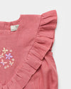 Early Sunday, Lucy Baby Bubble Romper in Peony color, made from 70% Cotton 30% Linen fabric, featuring a bubble pattern with beautiful embroidery, shown in a closeup flat-lay view