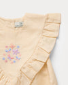 Early Sunday, Lucy Baby Bubble Romper in Sand color, made from 70% Cotton 30% Linen fabric, featuring a bubble pattern with beautiful embroidery, shown in a closeup flat-lay view