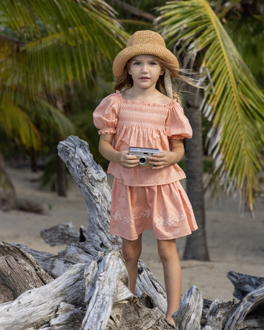 Early Sunday, Luna Skirt in Strawberry color, made from Cotton Dobby Swiss Dots fabric, featuring flattering silhouette with an easy fit, shown in a front view of model wearing it