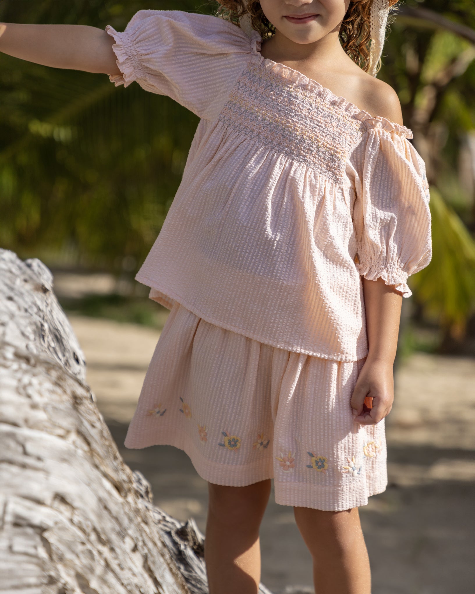 Early Sunday, Luna Skirt in Warm Sand color, made from Cotton Seersucker fabric, featuring flattering silhouette with an easy fit, combining style and comfort, shown in a close-up view of model wearing it