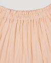 Early Sunday, Luna Skirt in Warm Sand color, made from Cotton Seersucker fabric, featuring flattering silhouette with an easy fit, combining style and comfort, shown in a close-up of print