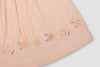 Early Sunday, Luna Skirt in Warm Sand color, made from Cotton Seersucker fabric, featuring flattering silhouette with an easy fit, combining style and comfort, shown in a closeup flat-lay view