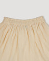 Early Sunday, Luna Skirt in Hazelnut Cream, made from Dyed Nylon Mesh Dobby fabric, featuring Elegant flow and gentle movement for everyday magic, shown in a closeup flat-lay view