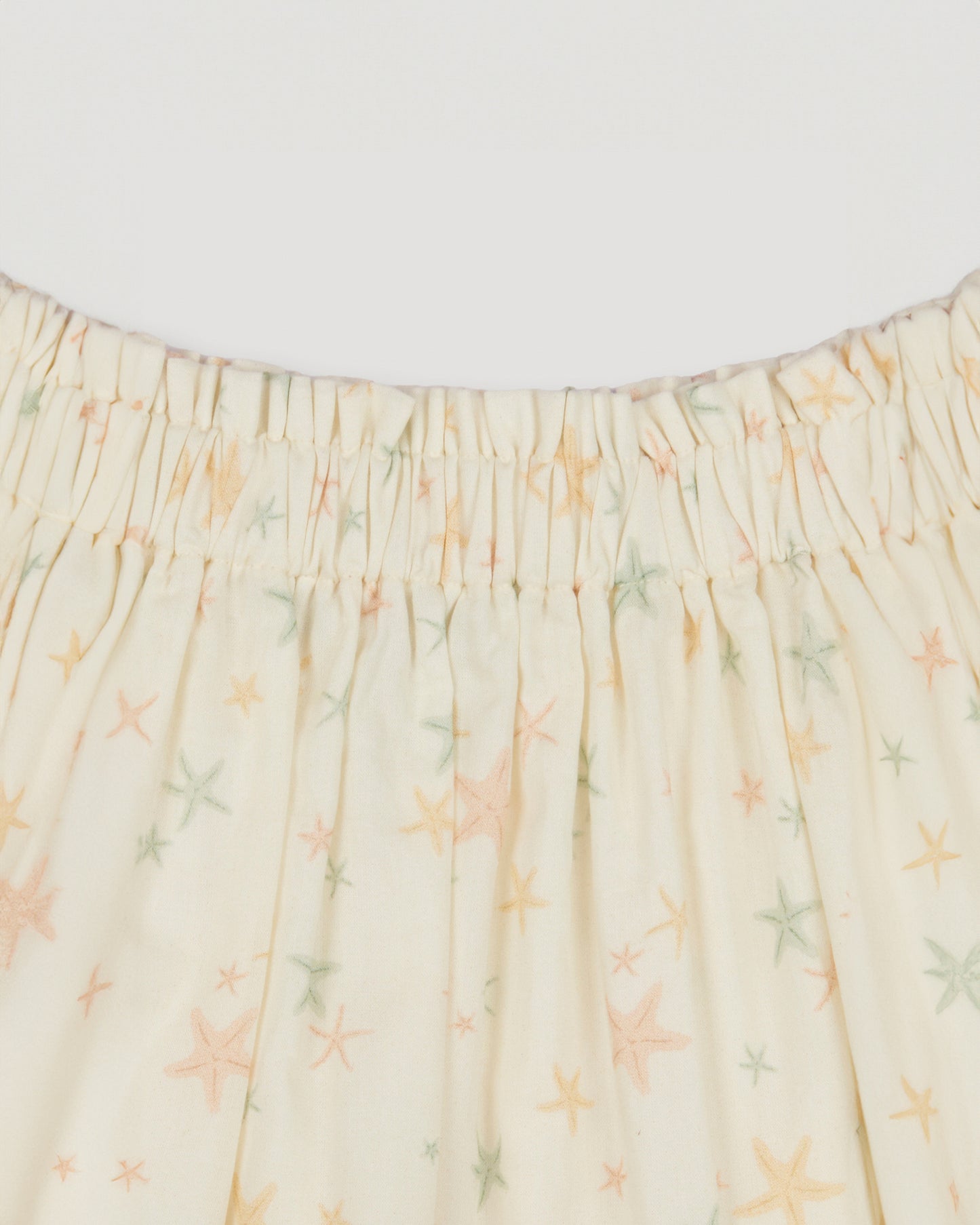 Early Sunday, Luna Skirt in Star Fish print, made from Printed Cotton Cambric fabric, featuring flattering silhouette with an easy fit, shown in a closeup flat-lay view