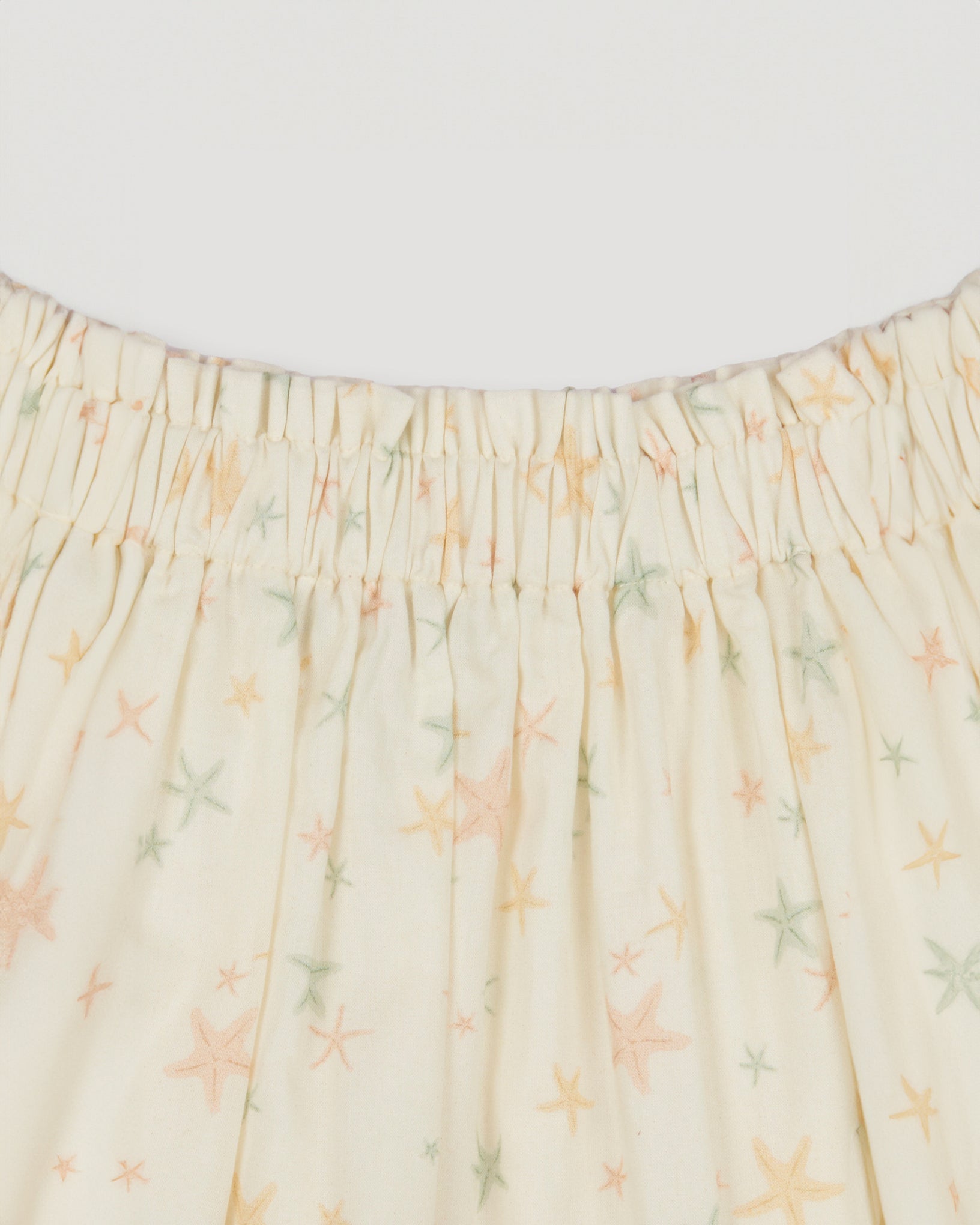 Early Sunday, Luna Skirt in Star Fish print, made from Printed Cotton Cambric fabric, featuring flattering silhouette with an easy fit, shown in a closeup flat-lay view