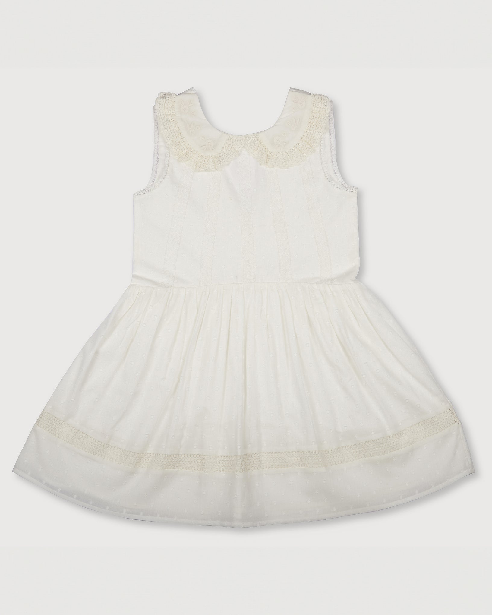 Early Sunday, LYS Dress in Ivory color, made from Cotton Dobby Swiss Dots fabric, featuring flattering fit with delicate finishes, combining style and functionality for an effortlessly elegant look, shown in a front flat-lay view