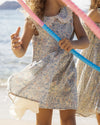 Early Sunday, LYS Dress in Amelia print, made from Printed Cotton Cambric fabric, featuring flattering fit with delicate finishes, combining style and functionality for an effortlessly elegant look, shown in a outdoor shot of model wearing it