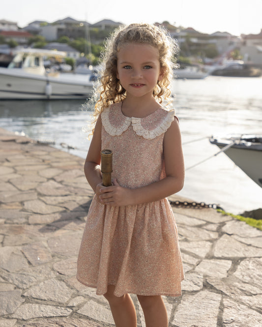 Early Sunday, LYS Dress in Garden Flowers print, made from Printed Cotton Cambric fabric, featuring flattering fit with delicate finishes, combining style and functionality for an effortlessly elegant look, shown in a front view of model wearing it