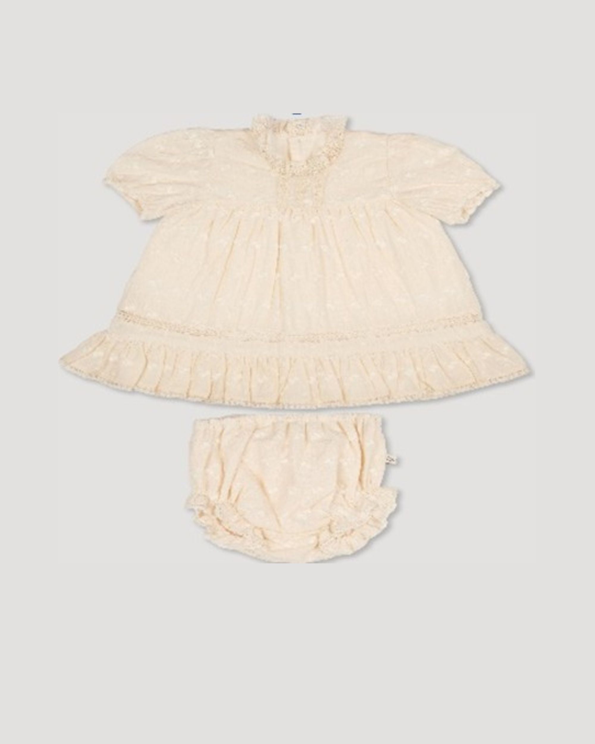 Early Sunday, Mae Baby Dress & Bloomer in Hazelnut Cream color, made from All-over Embroidered Cotton Cambric fabric, featuring lace yolk with beautiful embroidery, shown in a front flat-lay view