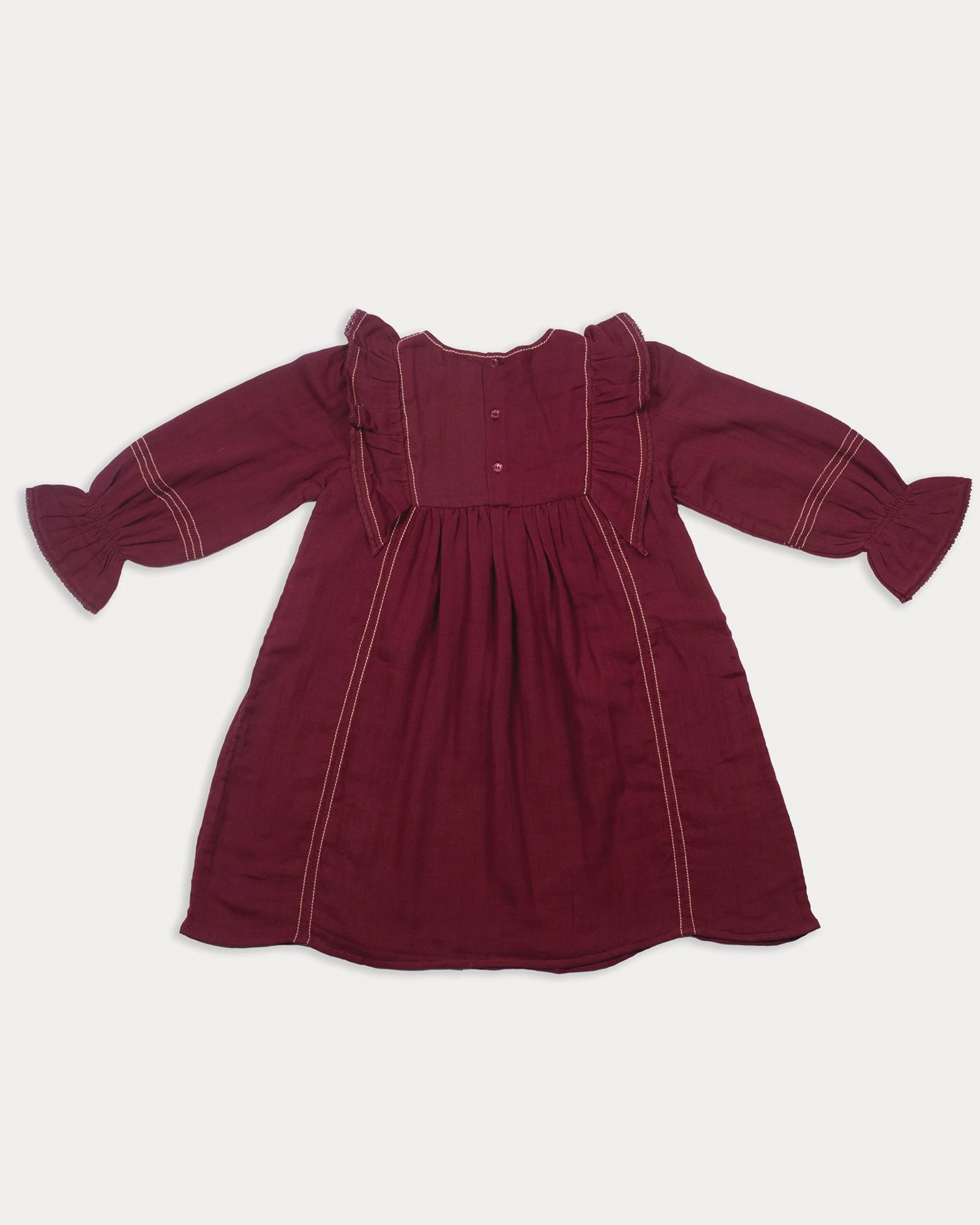 Early Sunday, Margot Dress in Plum, made from Cotton Double Gauze fabric, featuring classic silhouette with ruffle detailing around the sleeves, shown in a back flat-lay view
