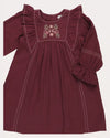 Early Sunday, Margot Dress in Plum, made from Cotton Double Gauze fabric, featuring classic silhouette with ruffle detailing around the sleeves, shown in a closeup flat-lay view