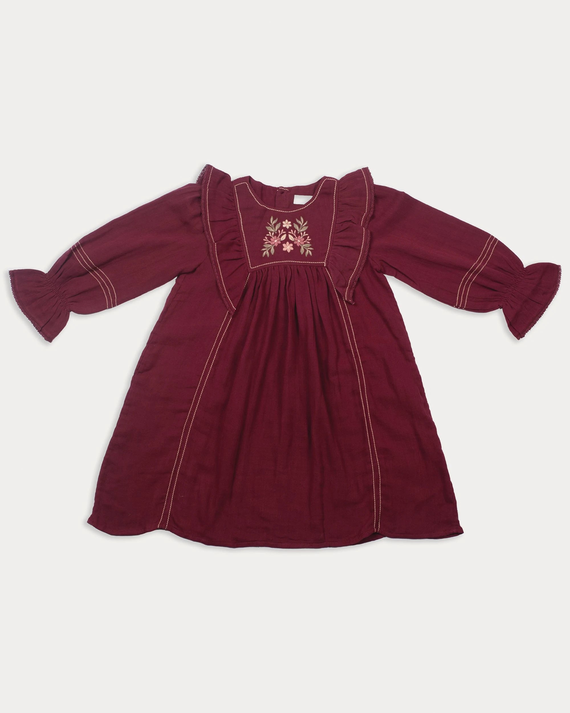 Early Sunday, Margot Dress in Plum, made from Cotton Double Gauze fabric, featuring classic silhouette with ruffle detailing around the sleeves, shown in a front flat-lay view
