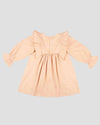 Early Sunday, Margot Dress in Beige, made from Cotton Satin fabric, featuring classic silhouette with floral embroidery around the yoke and ruffle detailing, shown in a back flat-lay view